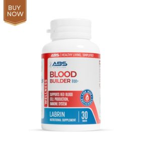 Image of a bottle of blood builder supplement with fresh fruits and leafy greens.