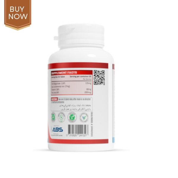 Image of a bottle of blood builder supplement with fresh fruits and leafy greens.